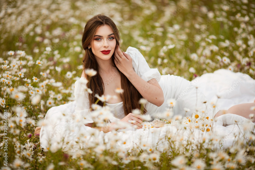 close portrait of a beautiful, laughing woman in a light dress holding a chamomile near her face during sunset, lit from the back close portrait of a beautiful, laughing woman in a light dress holding a chamomile near her face during sunset, lit from the back