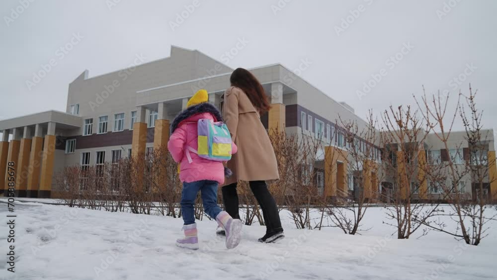 Vidéo Stock child schoolboy runs holding his mother hand school, child