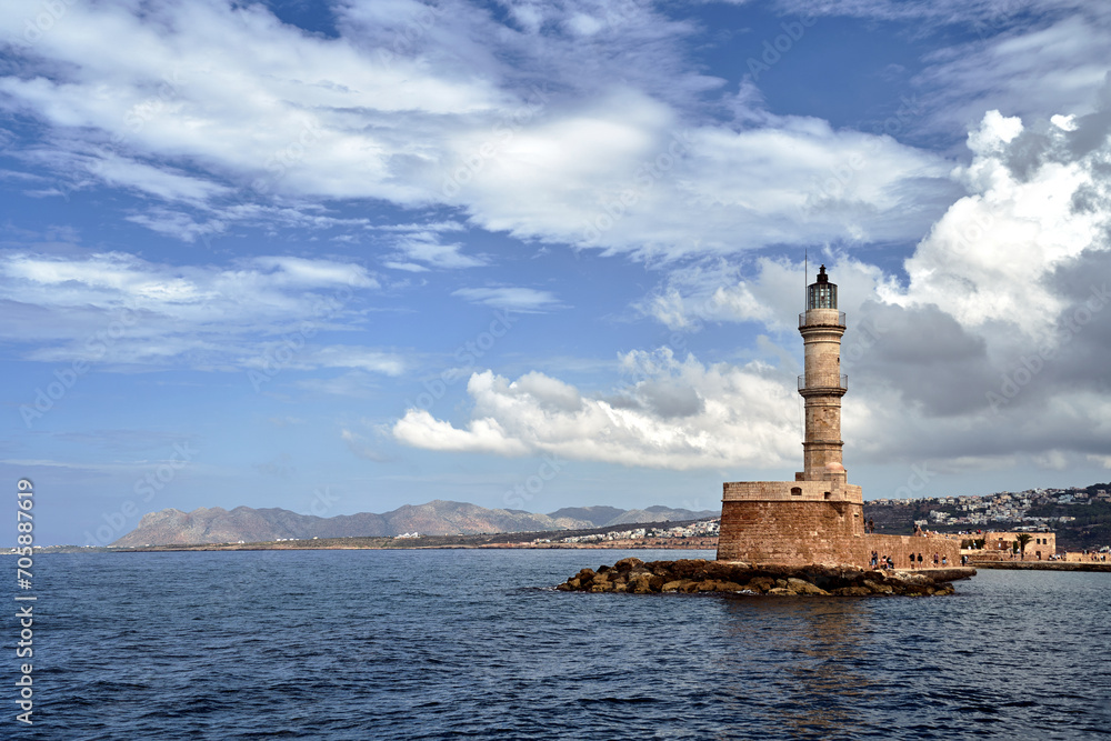stone, historic lighthouse in the harbor of Chania on the island of Crete