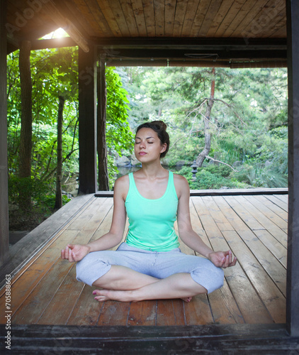 Free Download Young woman doing yoga asana in the evening - GFXLoad