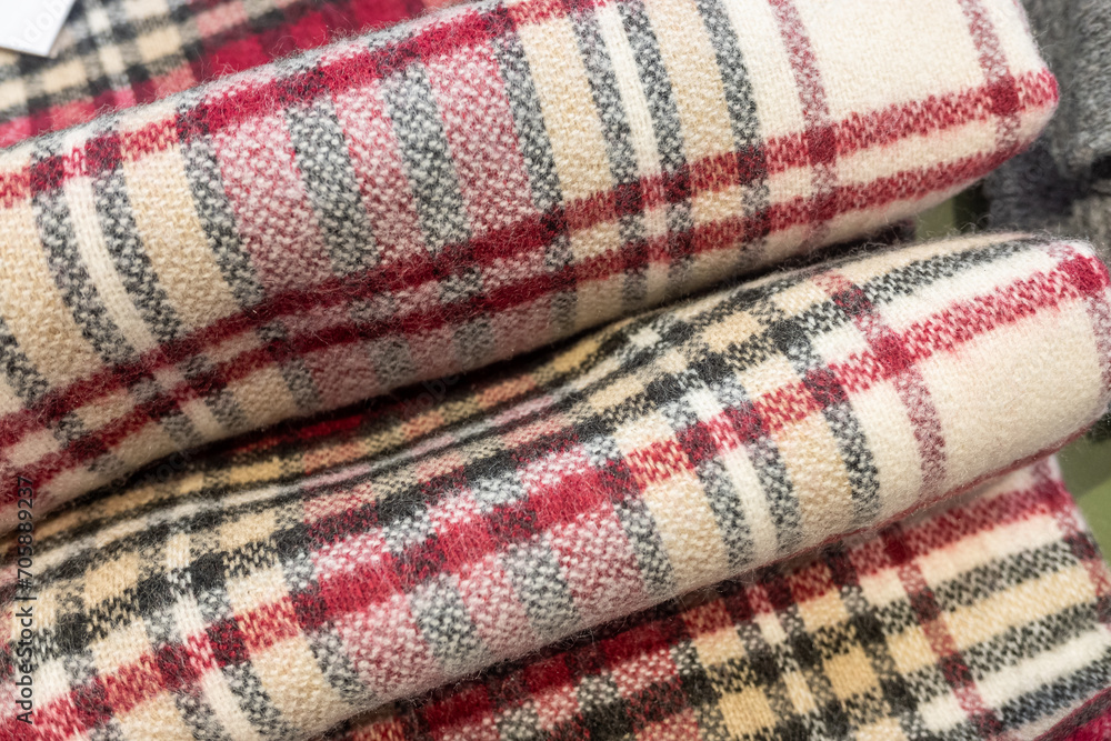 detail view of wool scarves at a fashion boutique detail view of wool scarves at a fashion boutique
