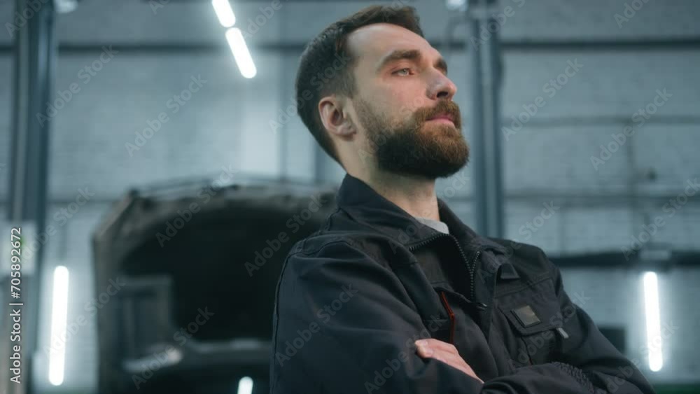 Portrait confident auto mechanic car service worker engineer posing with crossed hands in automobile garage workshop adult man repairman automotive electrician in uniform working in machine factory Portrait confident auto mechanic car service worker engineer posing with crossed hands in automobile garage workshop adult man repairman automotive electrician in uniform working in machine factory