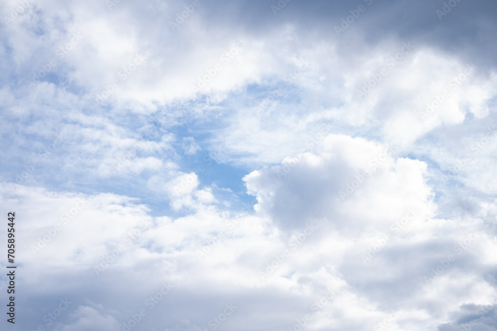 Blue cloudy sky, blue white background