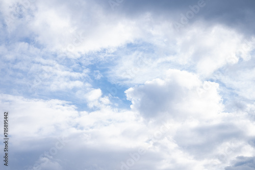 Blue cloudy sky, blue white background