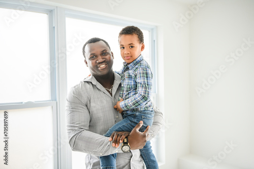 Happy American father with little boy at home