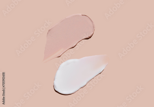 Cosmetic smear of cream texture on a beige background. Skin care. Tonal cream for the face.