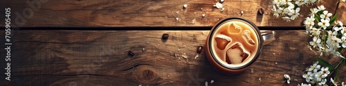 Cup of cappuccino with artistic cream design on a wooden table with white flowers. Panoramic shot with place for text. Rustic coffee break concept. Design for banner, menu, poster, board photo