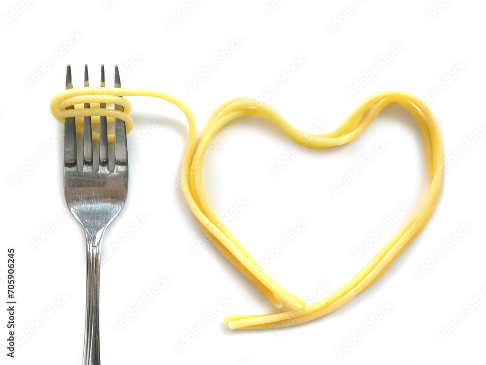 Fototapeta premium Heart shaped cooked capellini spaghetti with fork
