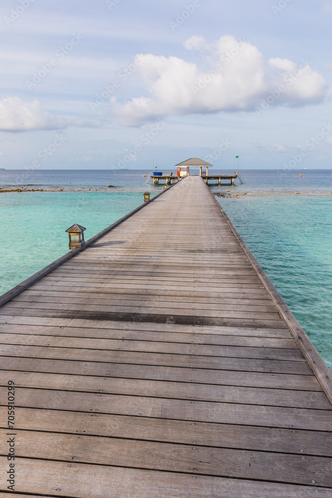 Fototapeta premium Wooden pier on a tropical beach in the Maldives