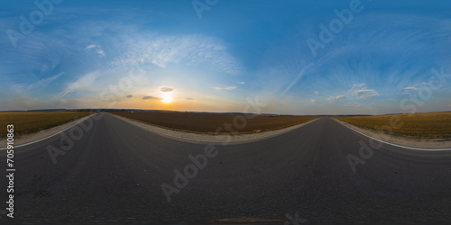 360 degree spherical panorama on country asphalt road among fields at sunset or sunrise with beautiful sky and cirrus clouds. VR content. photo