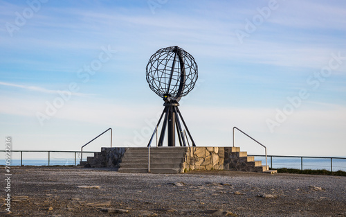 North Cape sculpture marking the northernmost point of the european continent in the middle of the night during midsummer photo