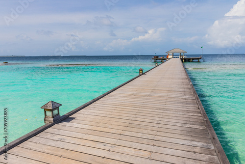 Fototapeta Naklejka Na Ścianę i Meble -  Wooden pier on a tropical beach in the Maldives