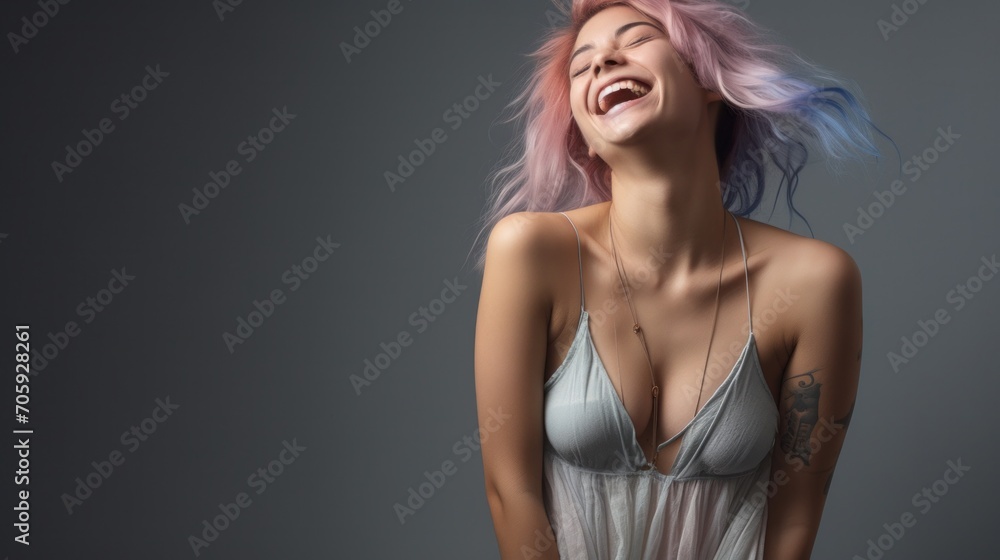 Fototapeta premium A woman with pink and blue hair laughing