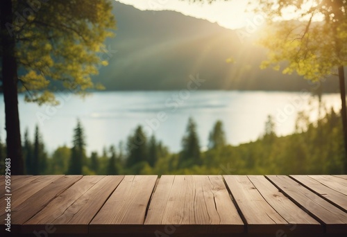 Empty wooden table top with blurred nature background Calm sunny day evening in nature with view to laake water