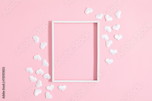 Valentine's Day concept. White confetti hearts on a pastel pink background. Love concept. Frame of hearts. Sample. © prime1001