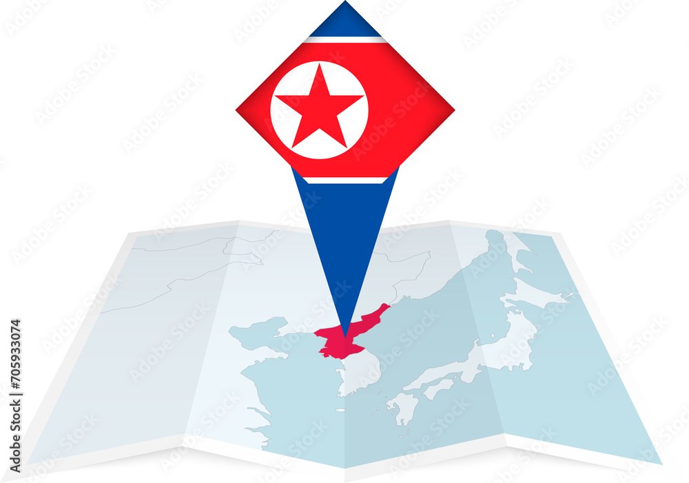 North Korea pin flag and map on a folded map North Korea pin flag and map on a folded map