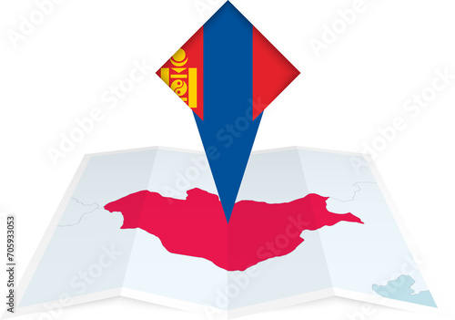 Mongolia pin flag and map on a folded map photo