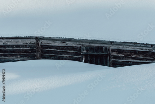 Wall of old summer farm barn up in the Totenaasen Hills at winter. © Øyvind