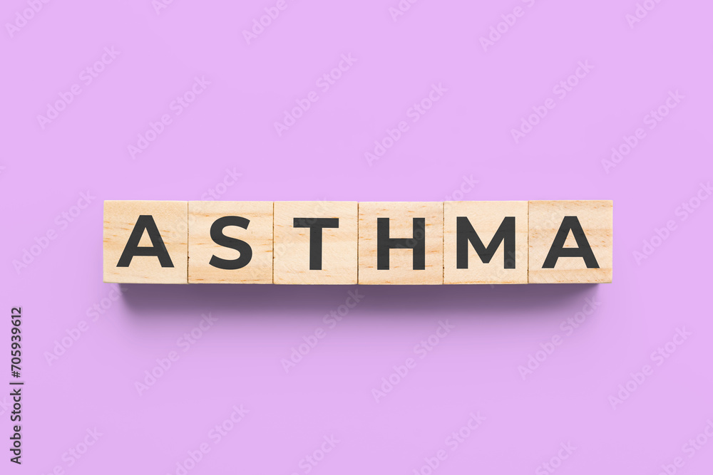 Fototapeta premium Asthma wooden cubes on purple background