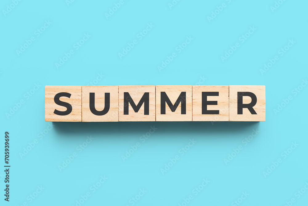 summer wooden cubes on blue background summer wooden cubes on blue background