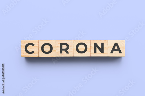 corona wooden cubes on blue background
