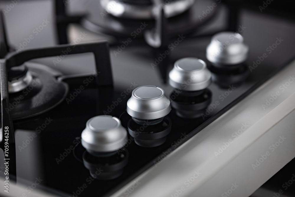gray hob control knobs, shallow depth of field gray hob control knobs, shallow depth of field