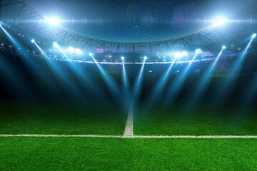 Modern football stadium with green lawn and blue spotlight. Soccer background. Football champions