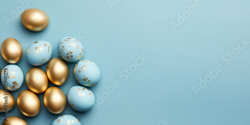 Easter frame of golden and pastel blue eggs on blue background. View from above. Flat lay style. Religion tradition pattern. Greeting card. Copy space.