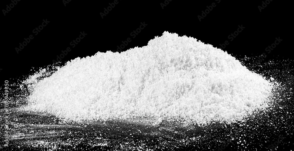Pile of white snow isolated on a black background. White fluffy snow. Pile of white snow isolated on a black background. White fluffy snow.