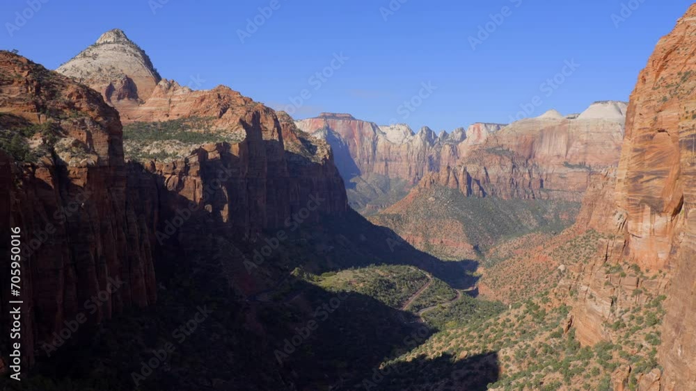 Establishing shot of mountains with red rocks in Canyon Overlook Trail, Zion National Park, Utah, North America. Day time. ProRes 422 HQ. Establishing shot of mountains with red rocks in Canyon Overlook Trail, Zion National Park, Utah, North America. Day time. ProRes 422 HQ.