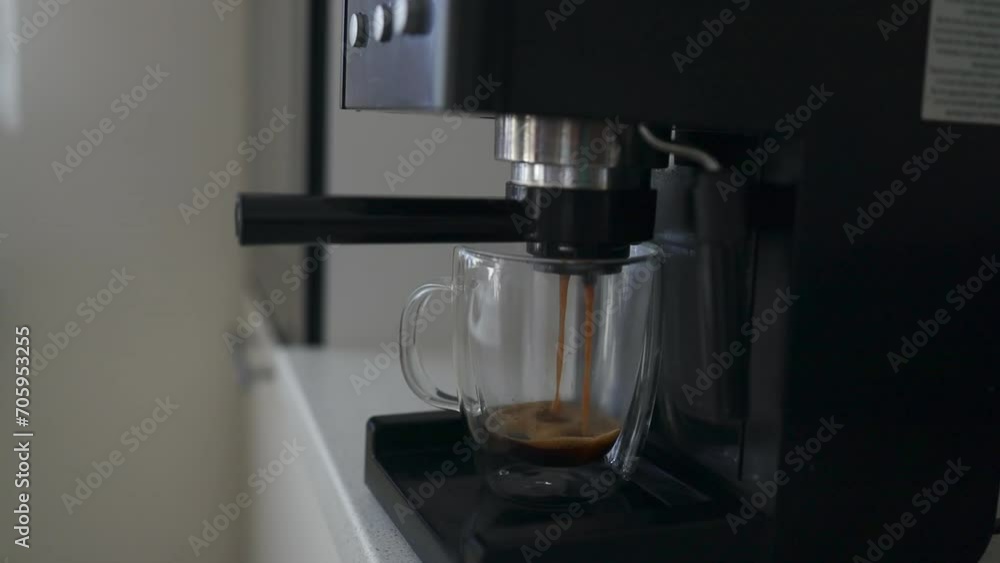 Making a cup of strong coffee in a coffee machine. High quality FullHD footage Making a cup of strong coffee in a coffee machine. High quality FullHD footage