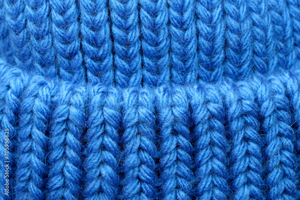 Textile blue background large knitted wool fabric Textile blue background large knitted wool fabric