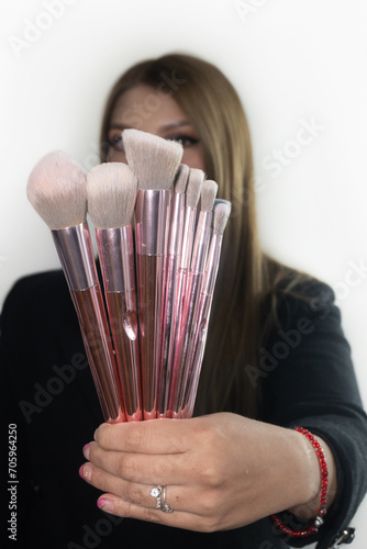 Makeup artist with model, doing her work, photo session taken in Monterrey, Nuevo Leon, Mexico