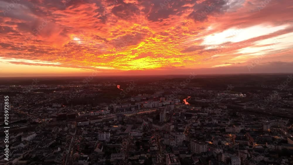 Fiery sunset skies above Le Mans city. Fiery sunset skies above Le Mans city.