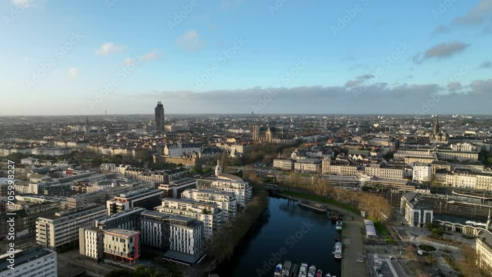The city of Nantes basks in the warm light of a setting sun. The city of Nantes basks in the warm light of a setting sun.