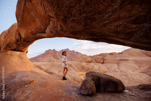 Happy woman traveling at Spitzkoppe, Namibia