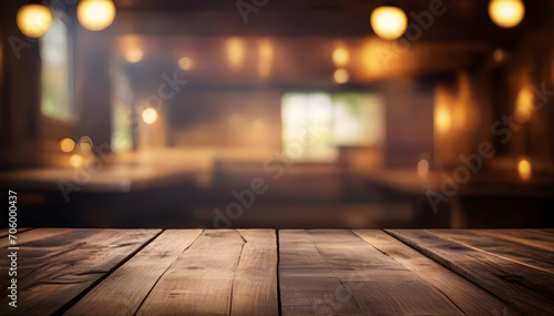 Rustic Empty wooden table top with lights bokeh on blur restaurant background, Vintage pub interior. Dark wood counter.