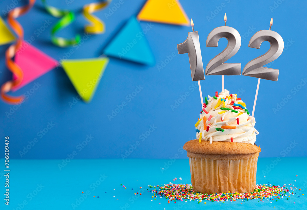 Candle number 122 - Cake birthday in blue background