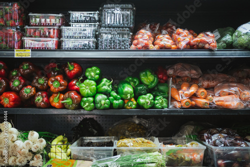 Fruits and vegetables at a fridge shelf in fruit store in Chile. Small business.