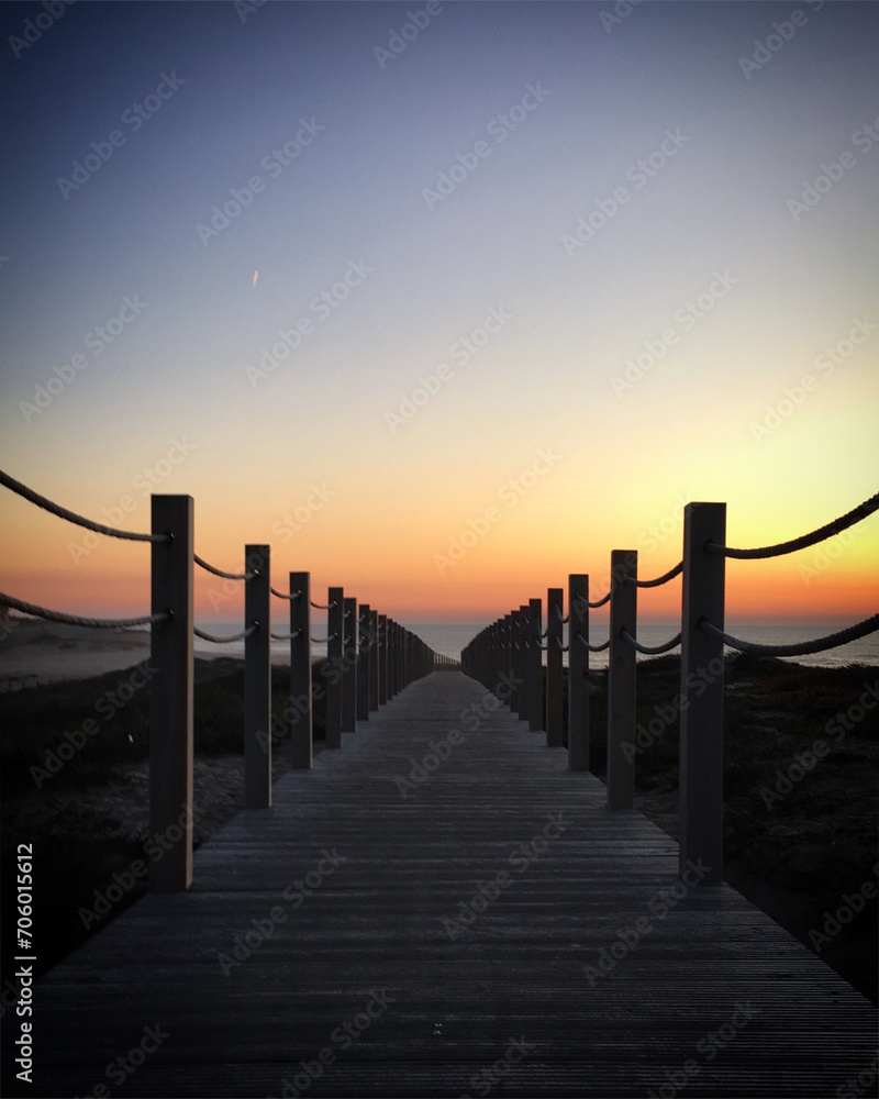 Boardwalk leading to the Atlantic Ocean beach during the sunset, Póvoa de Varzim, Portugal, December 2017