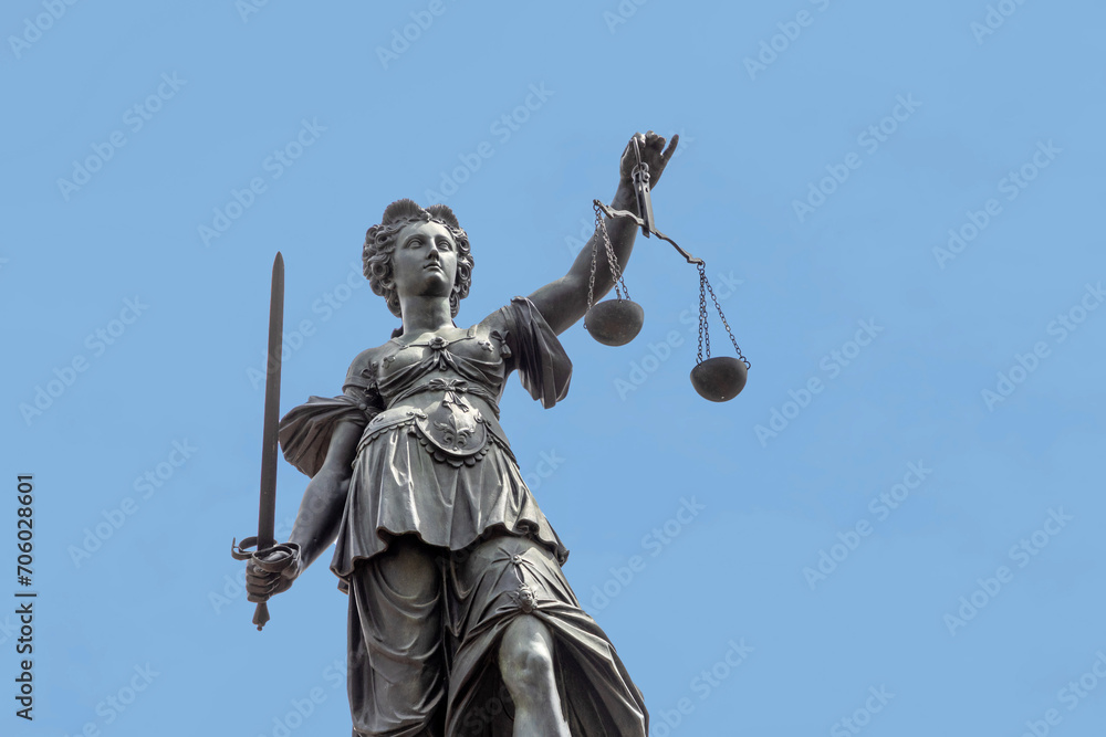 lady justice with sword in Frankfurt under blue sky lady justice with sword in Frankfurt under blue sky