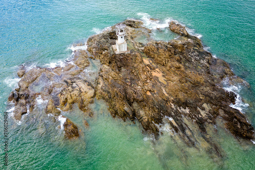 Aerial view of a small lighthouse off the tropical Nangthong Beach in Khao Lak, Thailand photo