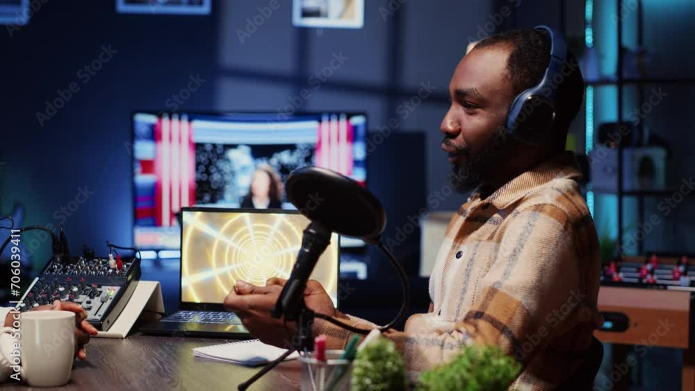 Online show host speaking with guest during live broadcast for social media platforms, listening to her opinion. African american influencer using professional gear to record podcast Online show host speaking with guest during live broadcast for social media platforms, listening to her opinion. African american influencer using professional gear to record podcast