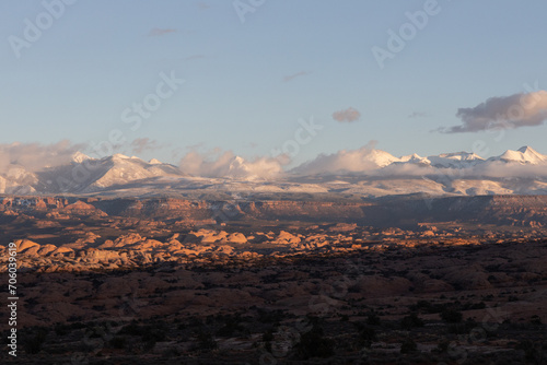 landscape with mountain range in the horizon at sunset