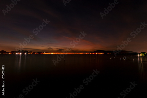 The background of the sea by the evening sea, with natural beauty (sea water, rocks, sky) and fishermen are fishing by the river bank, is a pleasure during travel.