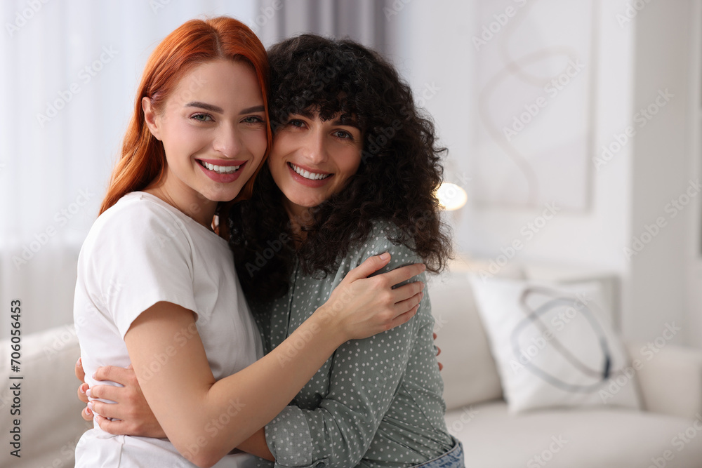 Obraz premium Portrait of happy young friends at home, space for text