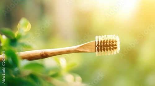 Closeup of a bamboo toothbrush with compostable bristles for a more sustainable oral care routine. © Justlight