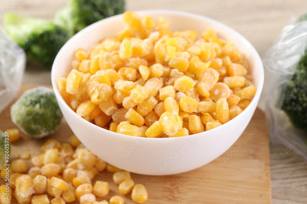 Frozen vegetables on wooden table, closeup view Frozen vegetables on wooden table, closeup view