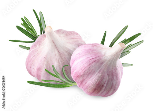 Garlic bulbs and green rosemary isolated on white