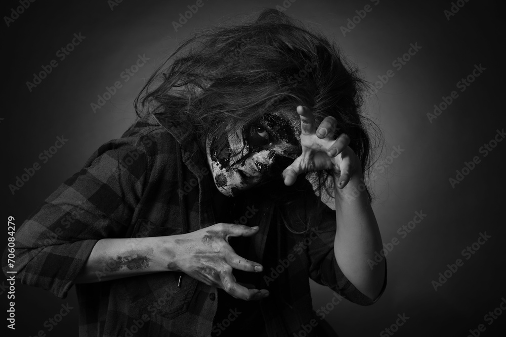 Scary zombie on dark background, black and white effect. Halloween monster Scary zombie on dark background, black and white effect. Halloween monster